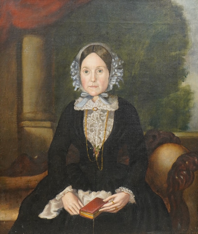 Victorian school, Portrait of a lady in mourning before a landscape, oil on canvas, 40 x 35cm, gilt framed
